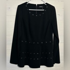 DKNY black long sleeve blouse with silver rivets. Tiered at waist. EUC